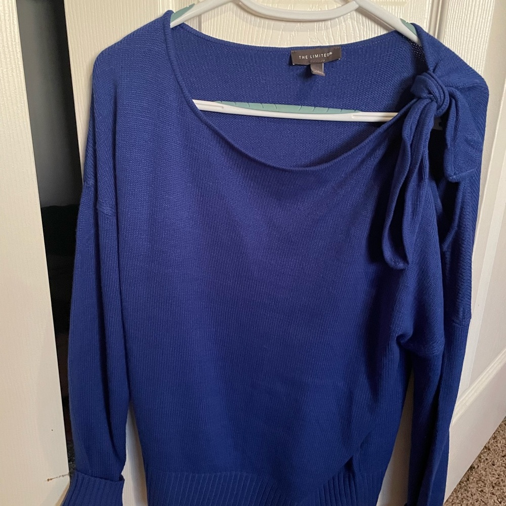 Limited sweater with open left shoulder. Only worn 2 times